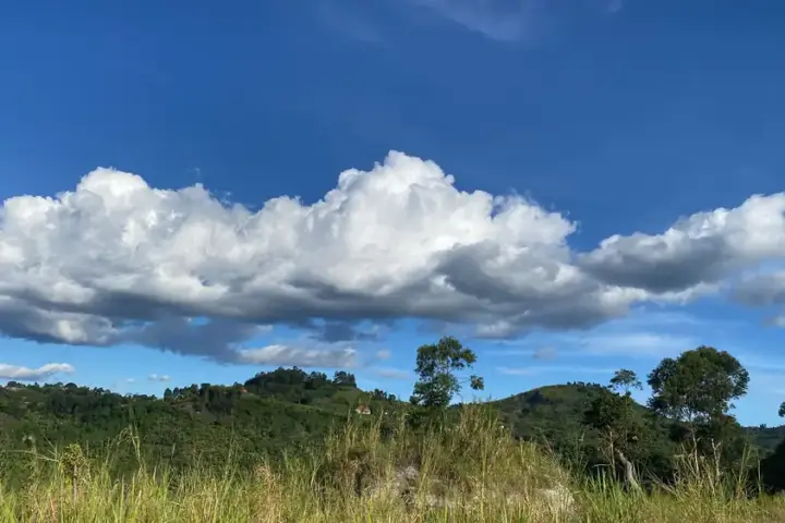 Rolling green hills and clouds over Rubirizi District in western Uganda near the Tooro Kingdom region