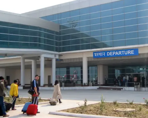 Interior of Varanasi airport departure hall with passengers and check-in counters
