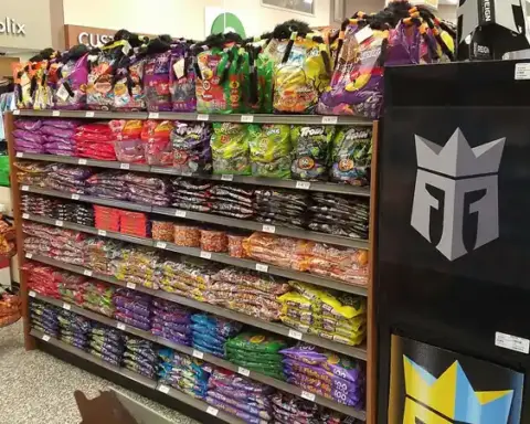 Retail store display featuring packaged Halloween candies and seasonal sweets on store shelves