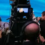 Professional television studio camera on production floor for broadcast and streaming channel operations