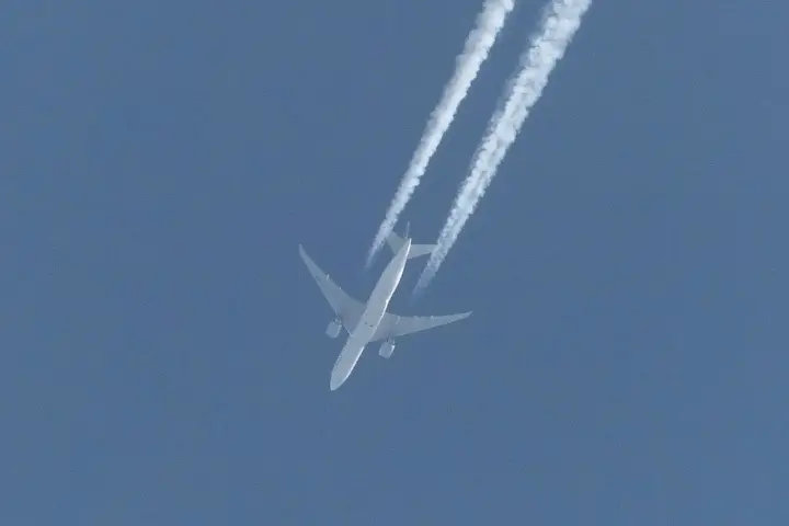 Ethiopian Cargo Boeing 777-F twin-engine widebody cargo aircraft climbing through the sky