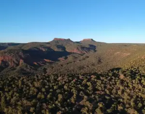Sandstone buttes and red rock canyon country under open sky in southeastern Utah