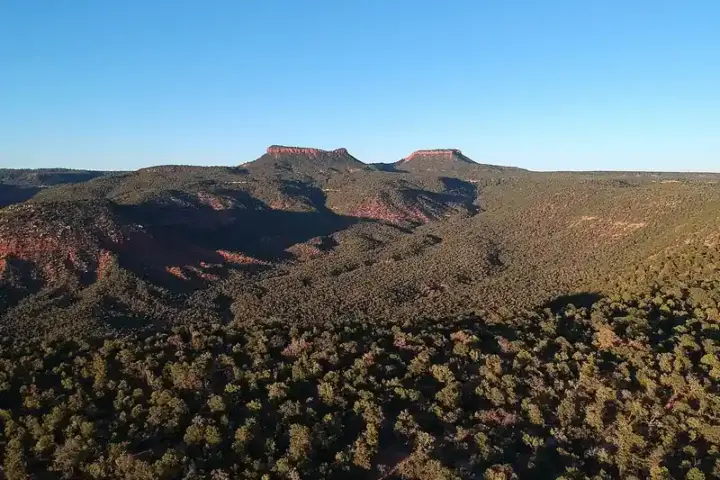 Sandstone buttes and red rock canyon country under open sky in southeastern Utah