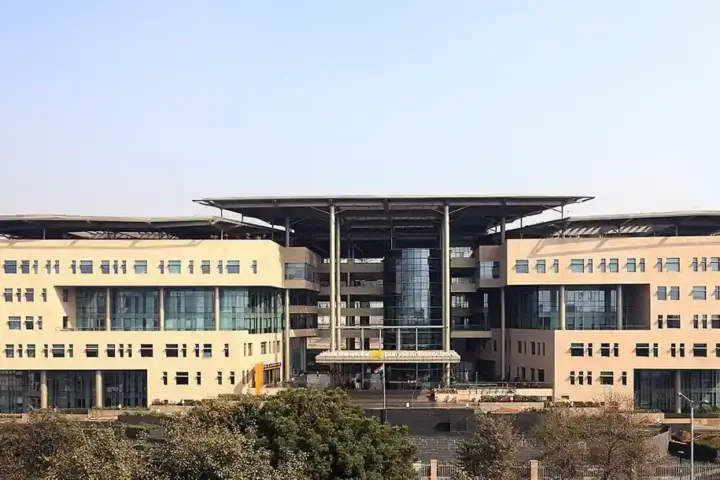 Exterior view of the modern multi-story Punjab National Bank corporate headquarters building.