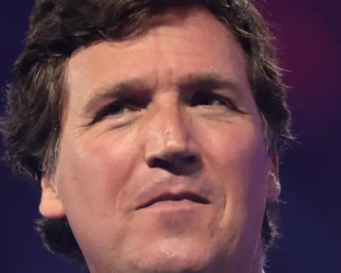 Tucker Carlson speaking to attendees at a public event in Arizona.