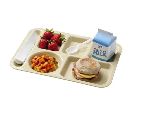 Cafeteria lunch tray featuring packaged shelf-stable milk cartons and breakfast items