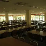 School cafeteria dining area with tables and seating arranged for students during the school day