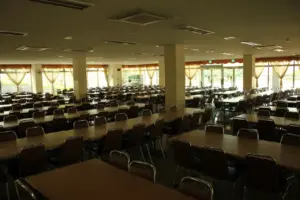 School cafeteria dining area with tables and seating arranged for students during the school day
