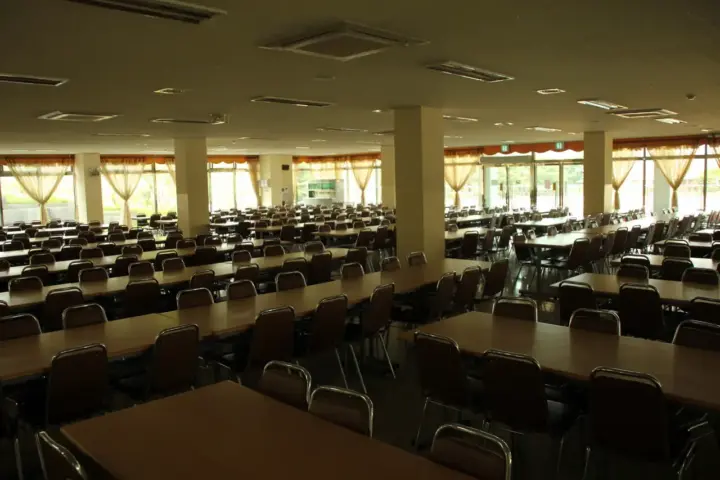 School cafeteria dining area with tables and seating arranged for students during the school day