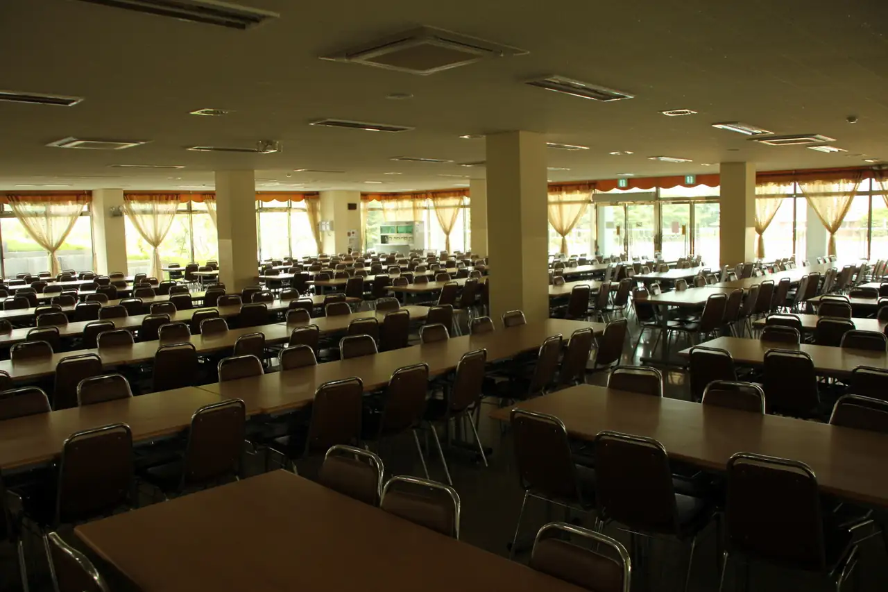 School cafeteria dining area with tables and seating arranged for students during the school day