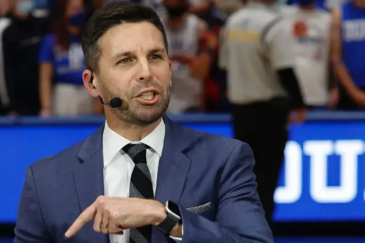 Chris Spatola in a suit and tie in an archival Duke basketball portrait