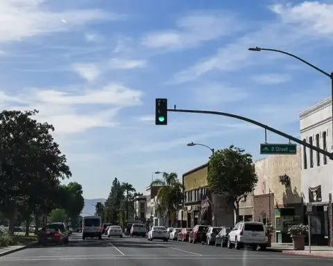 Street view of commercial buildings, paved roadways, and clear skies in downtown Ontario, San Bernardino County, California.
