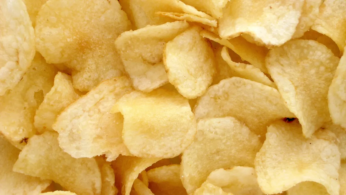 Potato chips representing a commonly consumed packaged snack food.