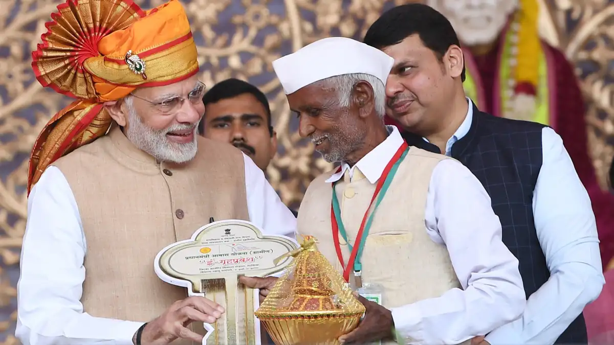 PMAY-G beneficiaries receiving keys to rural homes in India