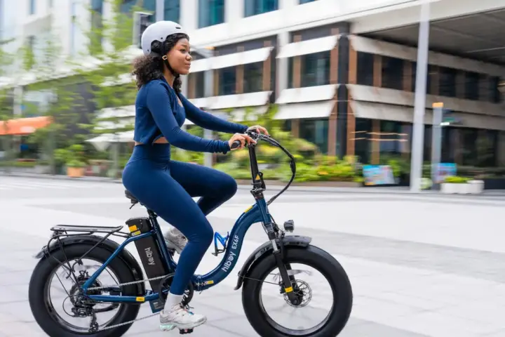 Woman riding an electric bicycle on a city street