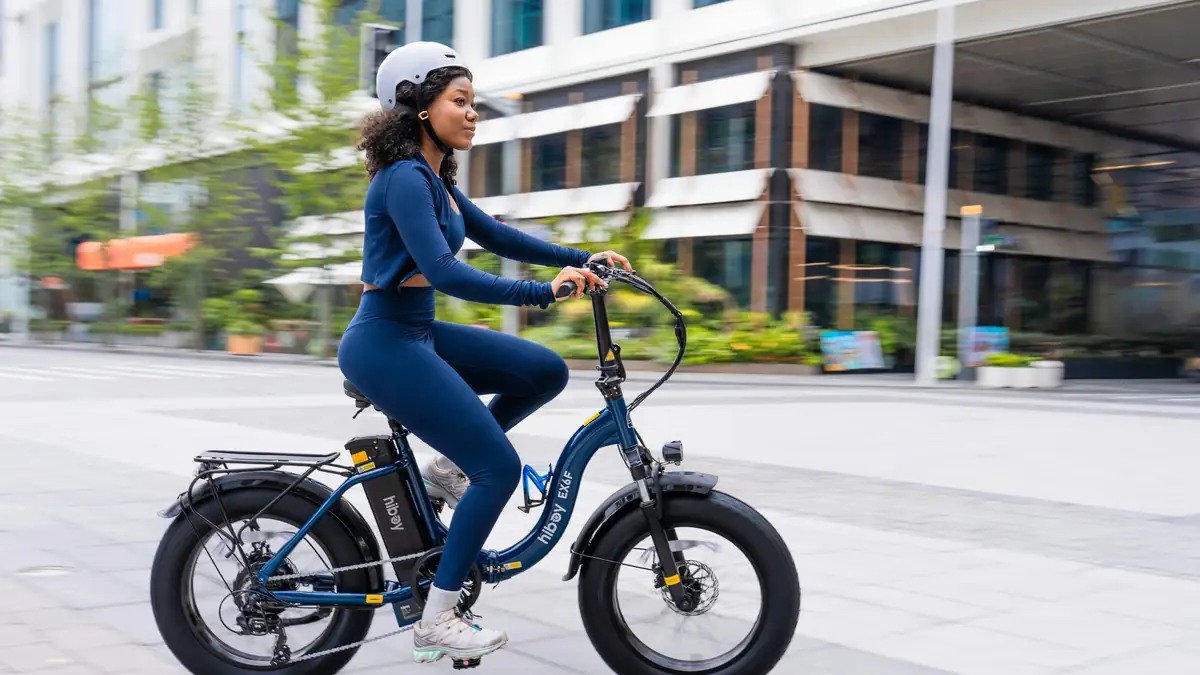 Woman riding an electric bicycle on a city street
