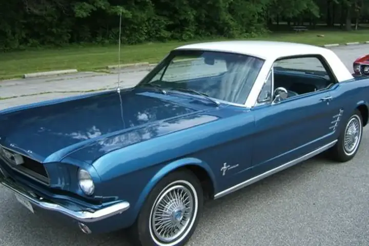 Classic Ford Mustang coupe parked outdoors representing collector vehicles