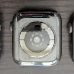 Close-up photograph of the back sensors on an Apple Watch without an active screen.
