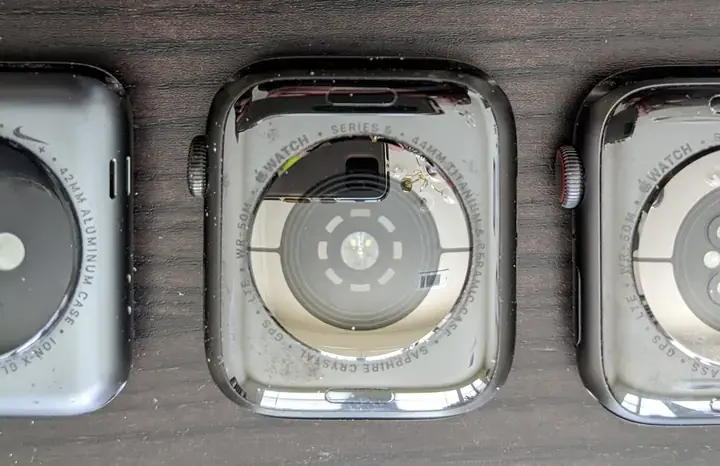 Close-up photograph of the back sensors on an Apple Watch without an active screen.