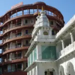 Exterior architectural photograph of the white marble ISKCON temple and dining facility premises in Juhu, Mumbai.