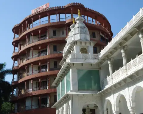 Exterior architectural photograph of the white marble ISKCON temple and dining facility premises in Juhu, Mumbai.