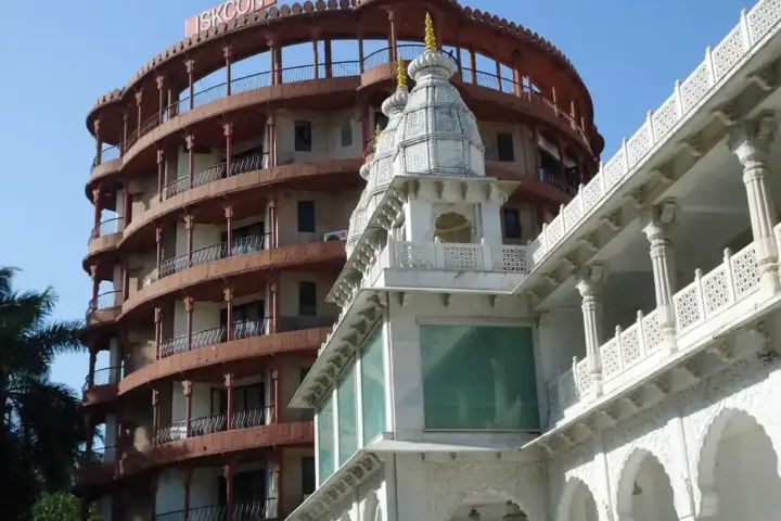 Exterior architectural photograph of the white marble ISKCON temple and dining facility premises in Juhu, Mumbai.