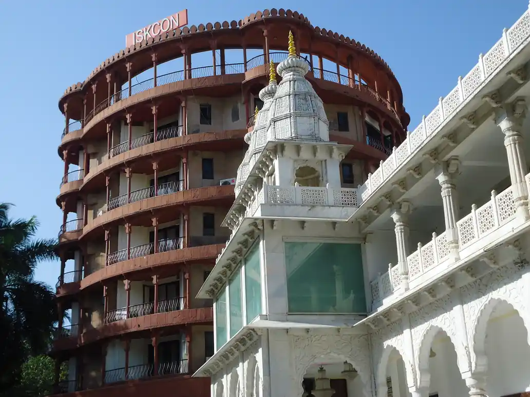 Exterior architectural photograph of the white marble ISKCON temple and dining facility premises in Juhu, Mumbai.