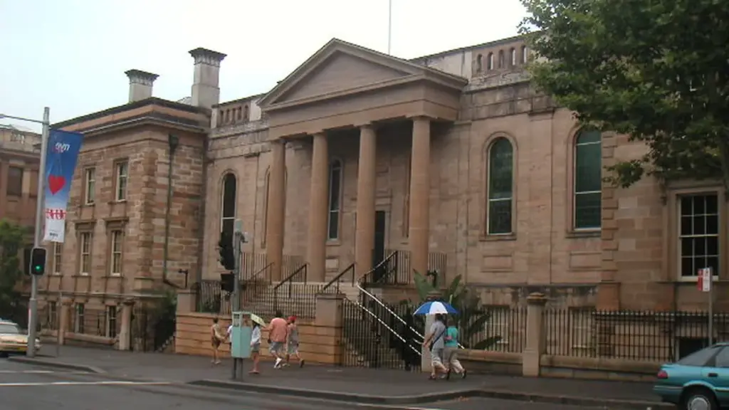 Exterior view of the historic sandstone Big School building and grounds of Sydney Grammar School in central Sydney.