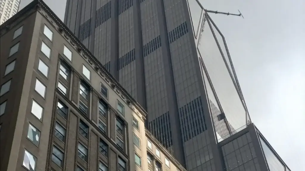 Tall corporate skyscraper headquarters of JPMorgan Chase rising in Midtown Manhattan, New York City.