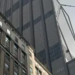 Tall corporate skyscraper headquarters of JPMorgan Chase rising in Midtown Manhattan, New York City.