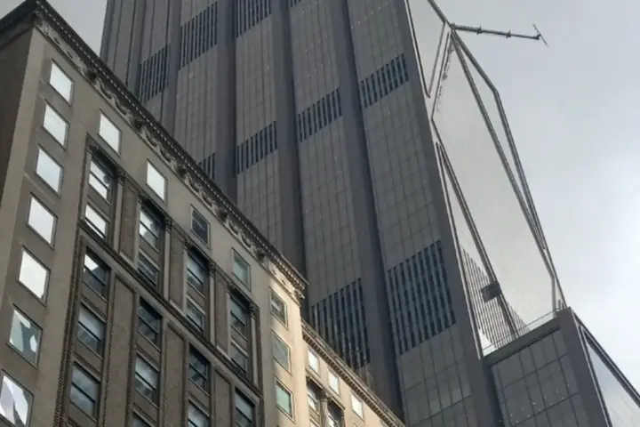 Tall corporate skyscraper headquarters of JPMorgan Chase rising in Midtown Manhattan, New York City.