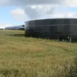A large black Permastore agricultural slurry tank on a rural Cheshire farm, the type of storage tank involved in the fatal farm incident.