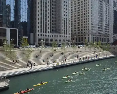 The pedestrian concourse along the Chicago Riverwalk beside the Chicago River in downtown Chicago.