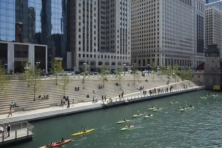 The pedestrian concourse along the Chicago Riverwalk beside the Chicago River in downtown Chicago.