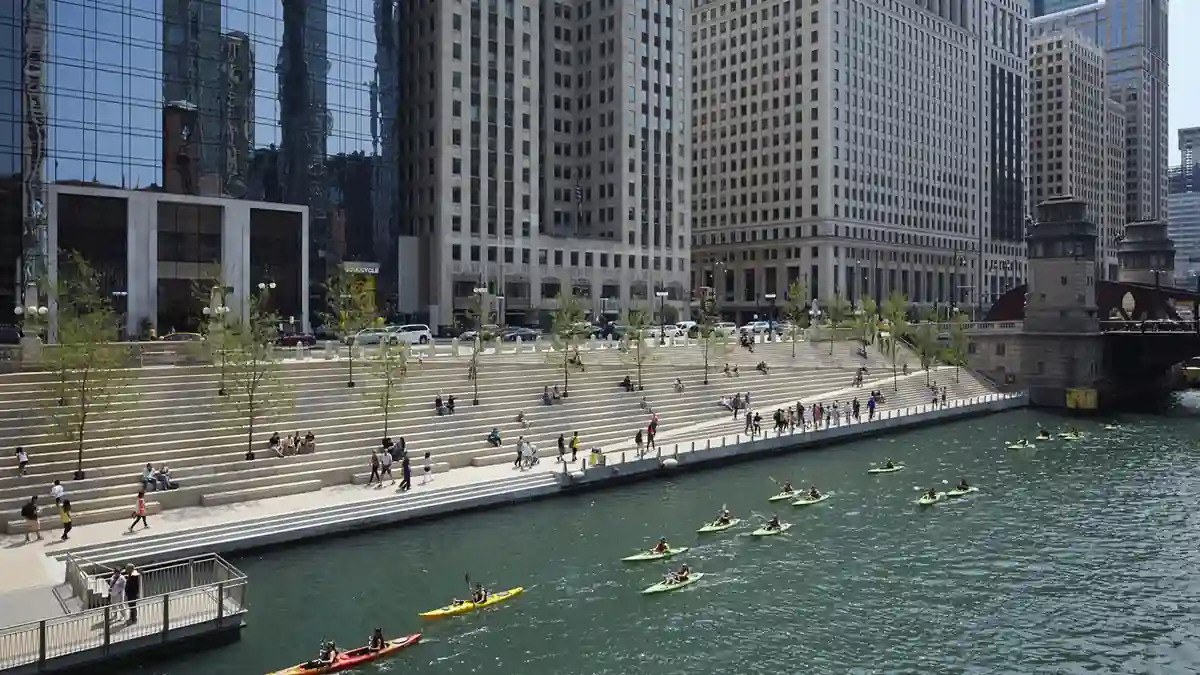 The pedestrian concourse along the Chicago Riverwalk beside the Chicago River in downtown Chicago.