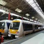 Silver and yellow Chiltern Railways passenger train at a UK station platform