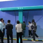 BYD flash charging station demonstration, representing China's rapid EV charging infrastructure expansion behind the 70% NEV target.