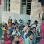 Indian classroom with students seated at desks used for Punjab Lecturer recruitment coverage.