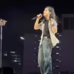 Ed Sheeran performing live on stage, the tour that lost four supporting acts after Macklemore withdrew.