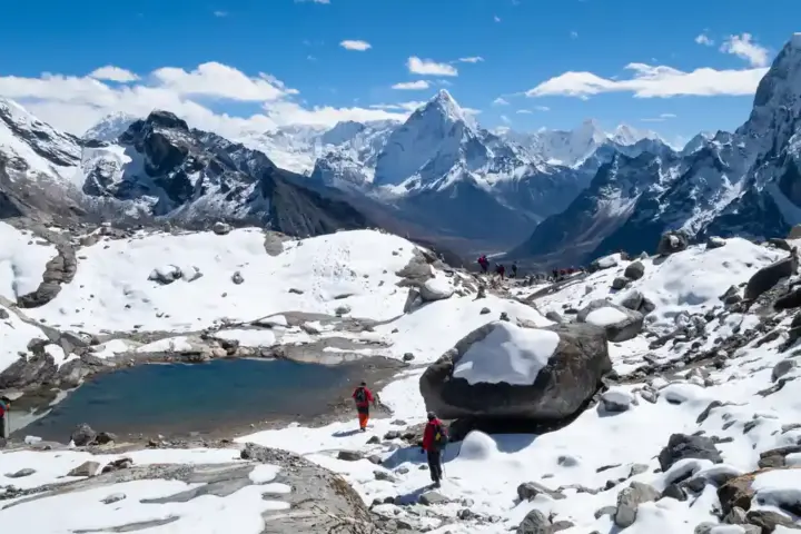 Snow-covered Himalayan mountains reflected in a mountain lake at Chola Valley Nepal