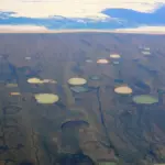 Thaw ponds forming on permafrost in Hudson Bay Canada as Arctic temperatures rise