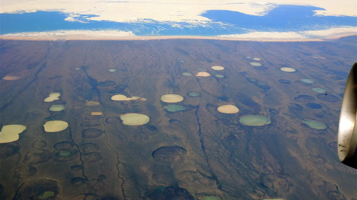 Thaw ponds forming on permafrost in Hudson Bay Canada as Arctic temperatures rise