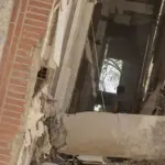 Residents walking through earthquake rubble in La Guaira, Venezuela