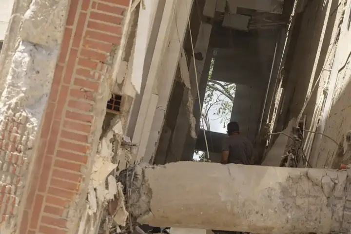Residents walking through earthquake rubble in La Guaira, Venezuela