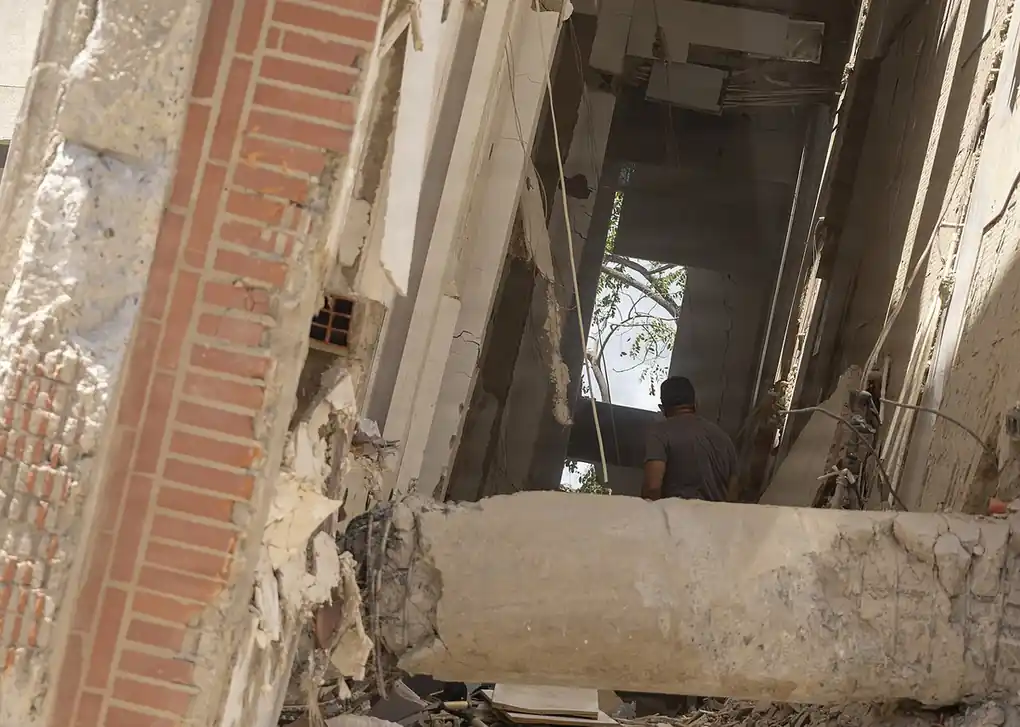 Residents walking through earthquake rubble in La Guaira, Venezuela