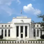Exterior facade and classical marble columns of the Marriner S. Eccles Federal Reserve Board Building in Washington, D.C.