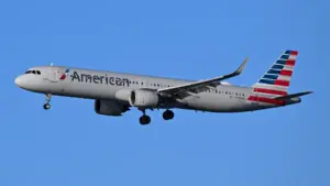 An American Airlines commercial passenger aircraft descending on final approach toward an airport runway