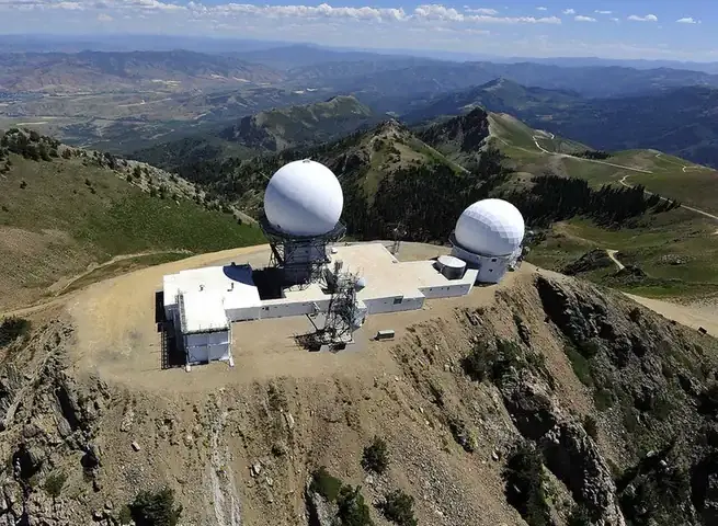Panoramic photograph of the Francis Peak mountain ridgeline and communication towers in the Wasatch Range above Davis County, Utah, where a tornado touched down at 7,500 feet elevation.