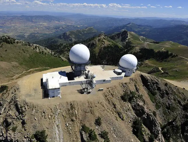Panoramic photograph of the Francis Peak mountain ridgeline and communication towers in the Wasatch Range above Davis County, Utah, where a tornado touched down at 7,500 feet elevation.