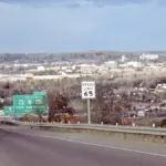 Overview of the city of Great Falls, Montana, showing residential neighborhoods, commercial structures, and the Missouri River corridor.